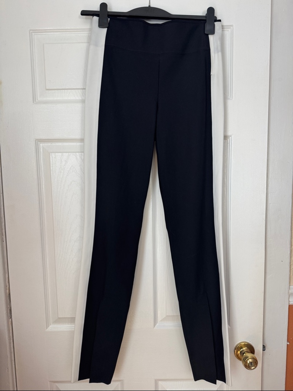 ATHLETA women’s  Black fitted pants with White Side Panels, size 4